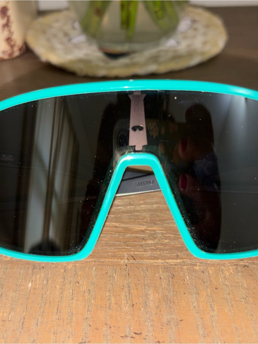 Woman teal Oakley sunglasses